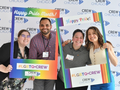 four people celebration LGBTQ Pride month with CREW Chicago