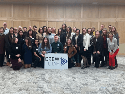 Group photo holding a CREW Utah sign