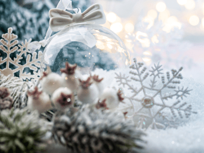 Christmas white decorations on snow with fir tree branches and christmas lights. Winter Decoration Background