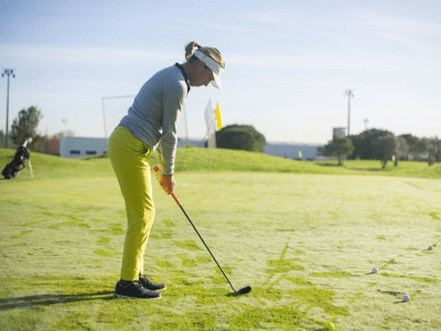 Female Golfer on Putting Green