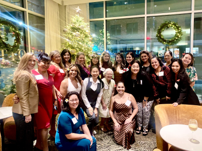 Women standing in front of a Christmas tree