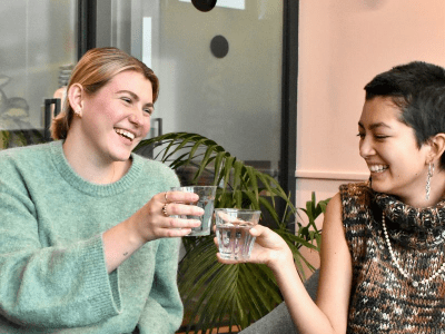 two women drinking cocktails