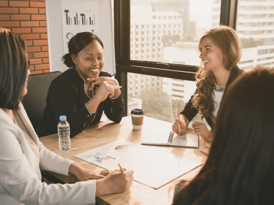 Happy diverse businesswoman leaders in meeting room