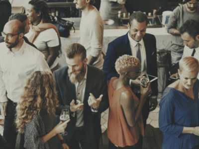 man-standing-group-of-people-happy-hour