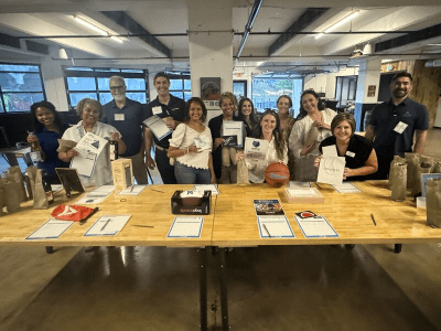 People standing behind a sign up table
