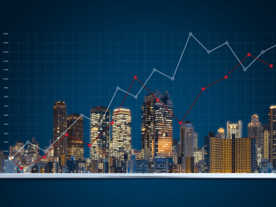 real estate commercial buildings beaming out of a tablet with superimposed trendlines