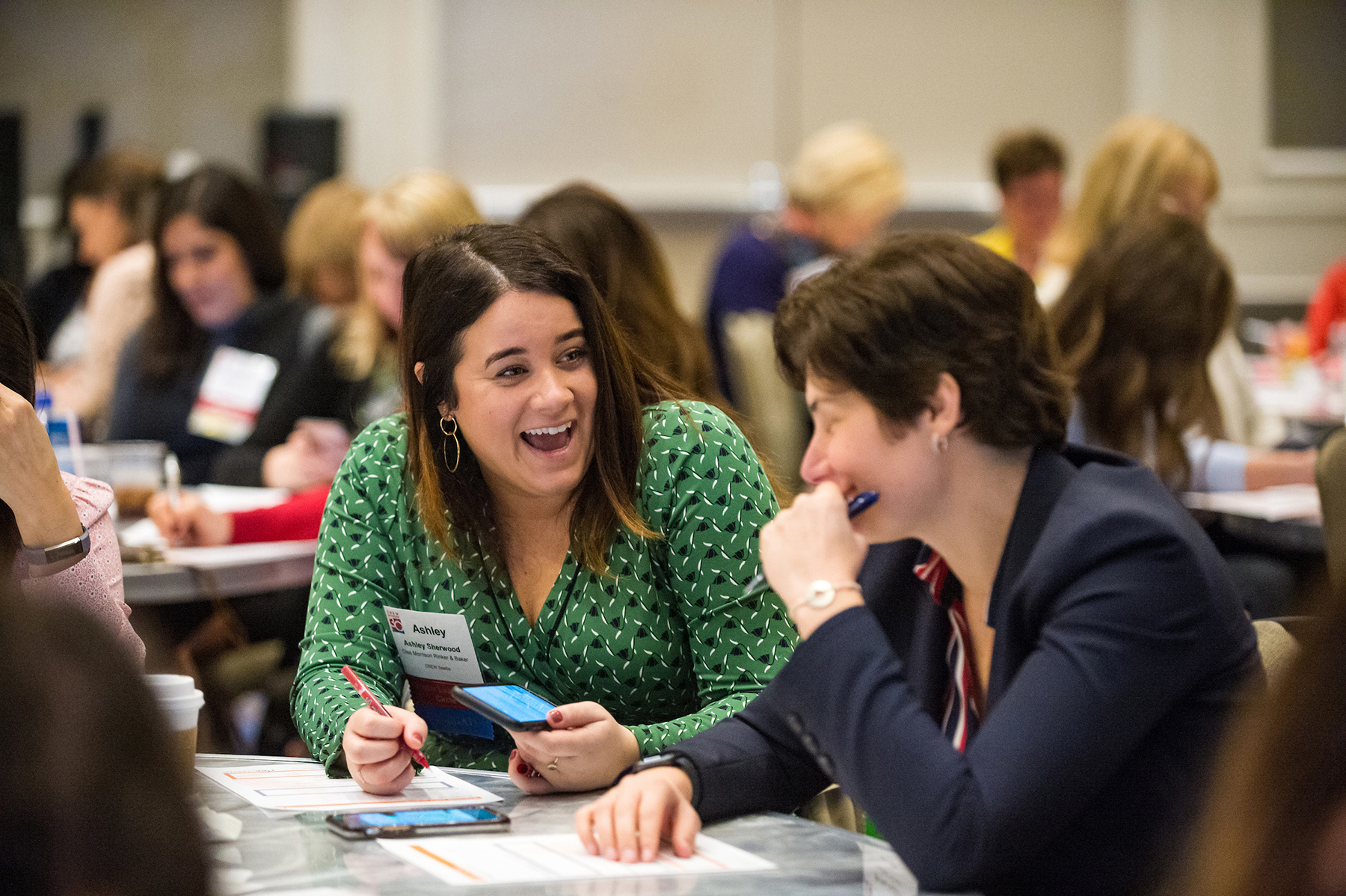 Women at a CREW Network Summit Laughing