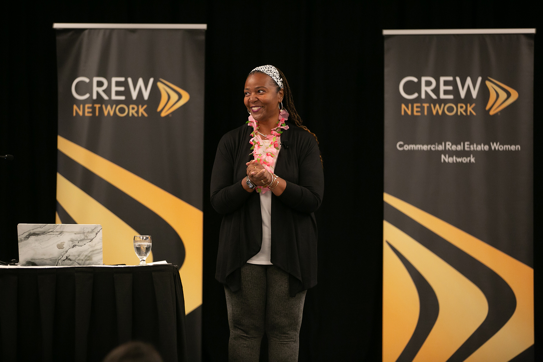 Woman speaking at CREW Network event