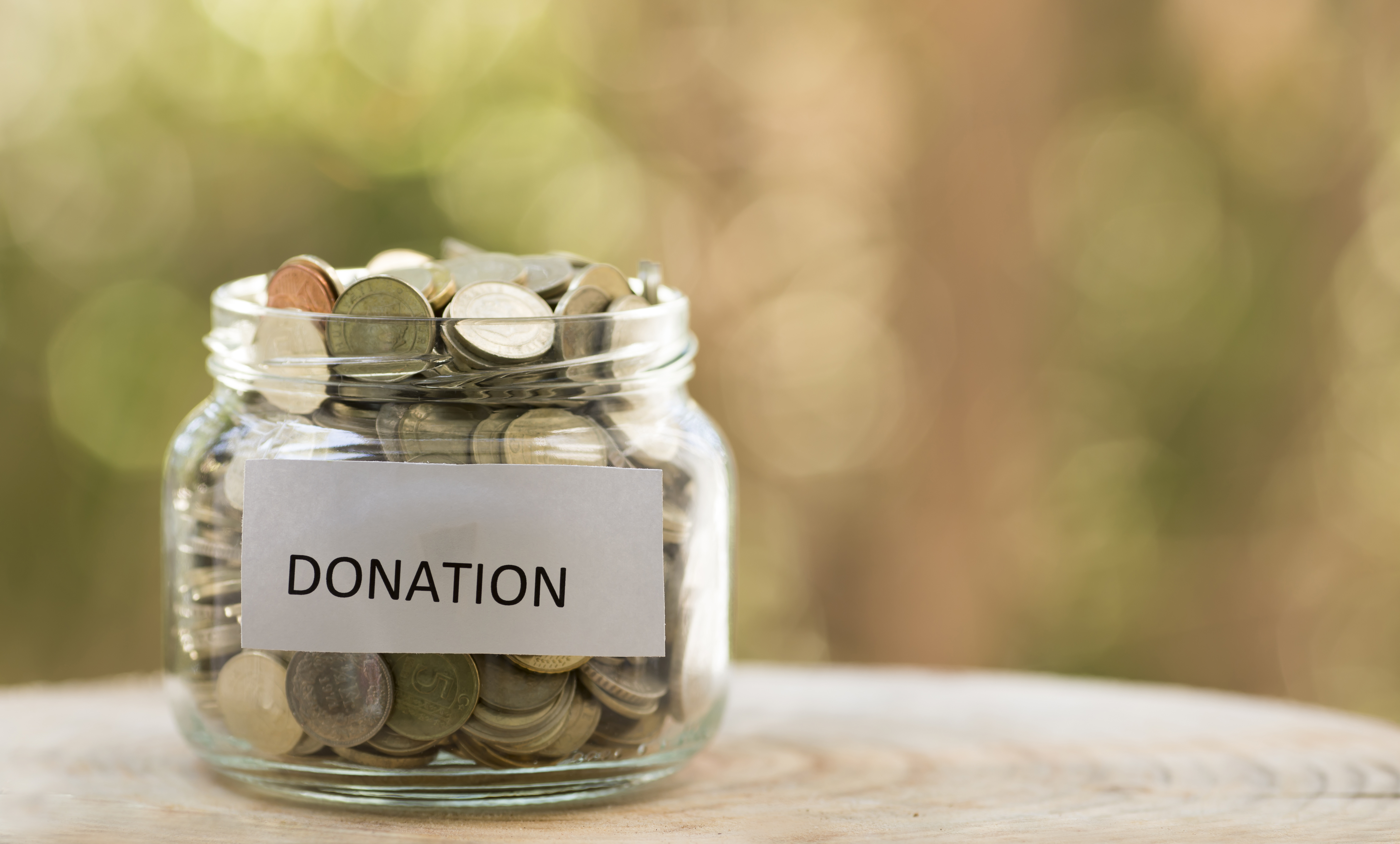 jar filled with change labeled donations