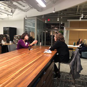 two women speaking at a speed networking event