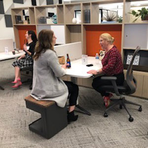 two people laughing at a speed networking event