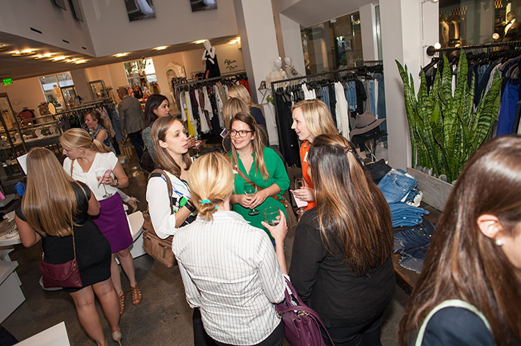 women networking at clothing store