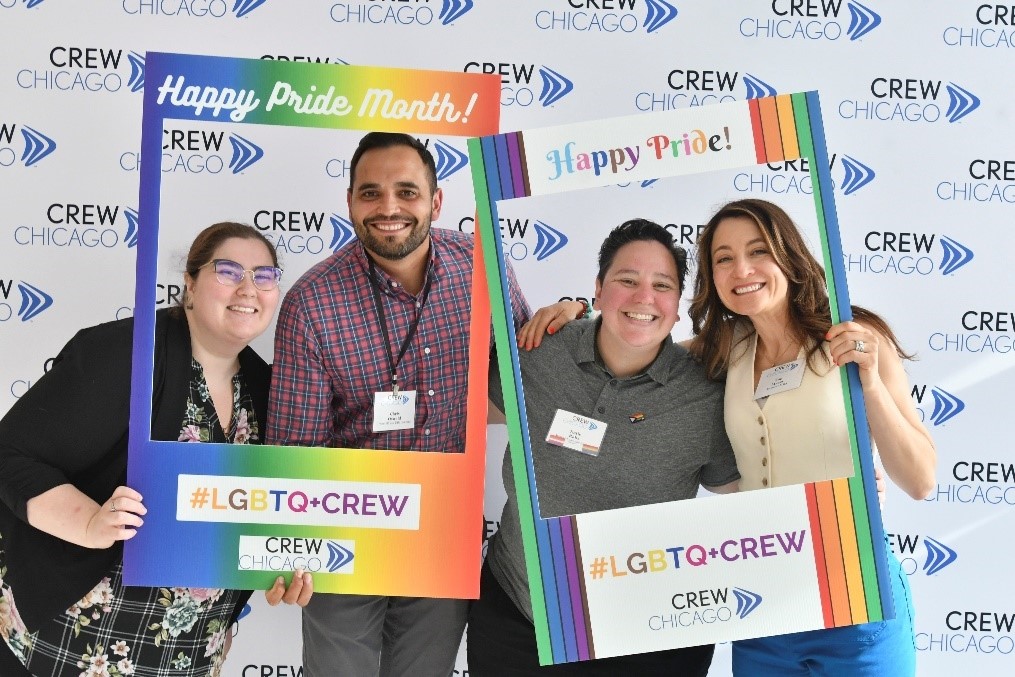 four people celebration LGBTQ Pride month with CREW Chicago